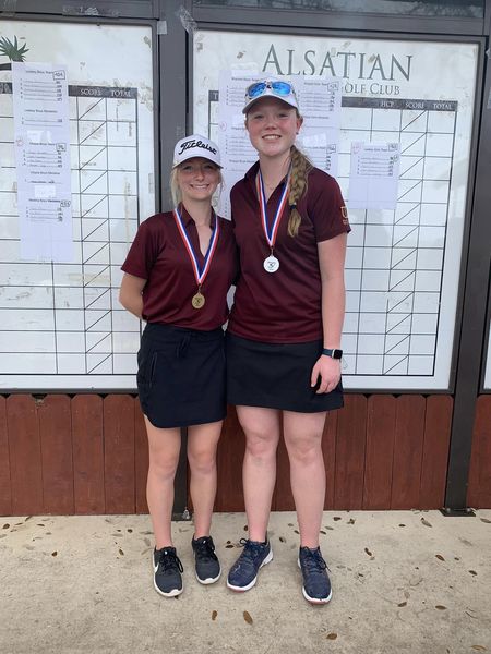 Kinsley Cox (1st place) and Hallie Moore  (2nd place) show-off their gold and silver medals from the Castroville tournment