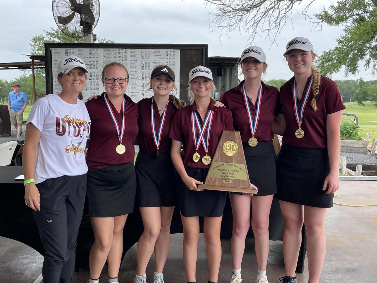 Coach McCarty, Danika McCarty, Riley McCutcheon, Kinsley Cox, Lizzy Hryniszak, and Hallie Moore pose with their first place trophy