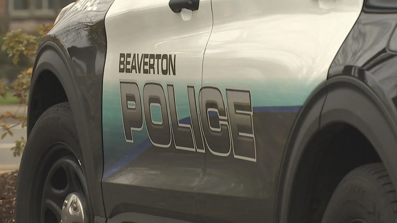 Police investigate a motorcycle crash scene on a Beaverton roadway